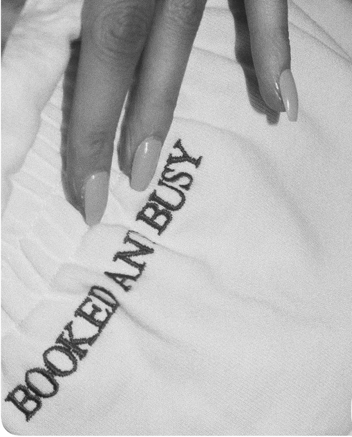 Booked and Busy embroidered detail with manicured nails